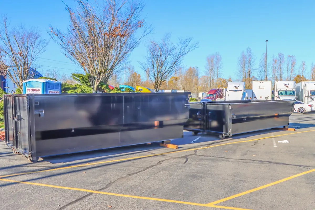 Professional dumpster rental service with roll-off container on residential driveway in Wytheville